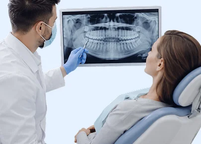 Dentist reviewing a dental X-ray with a patient