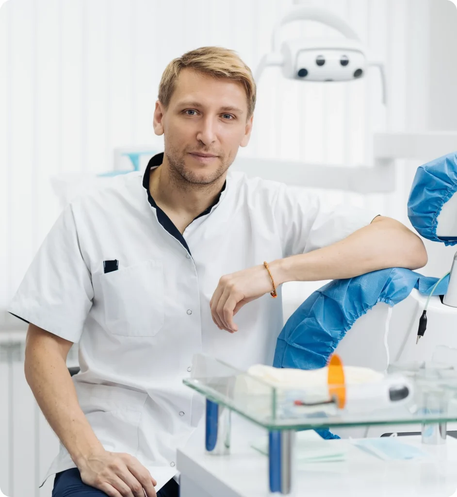 Smiling dentist in a modern dental treatment room