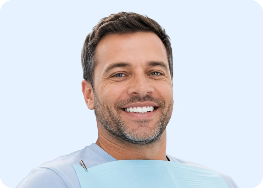 Smiling man during the dental implant healing phase